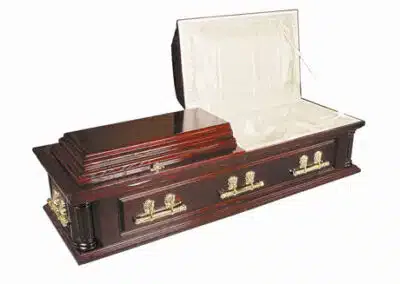 Buckingham English casket in dark polished wood with brass handles and interior lining