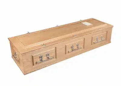 Chester English casket in light oak finish with silver-tone handles and fittings