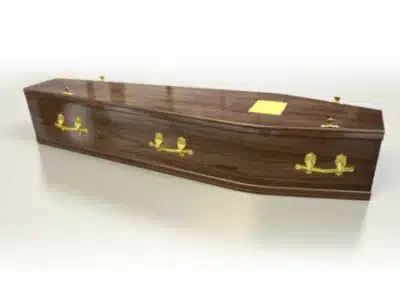 Classic dark polished wood coffin with traditional brass handles and fittings